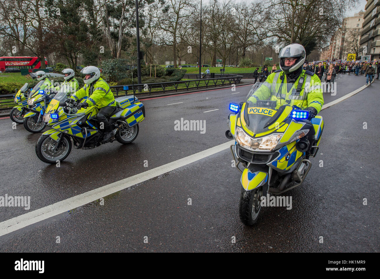 London, UK. 4th February, 2017. Police lead the way - A march against racism and to ban the ban (against immigration from certain countries to the USA) is organised by Stand Up To Racism and supported by Stop the War and several unions. It stated with a rally at the US Embassy in grosvenor Square and ended up in Whitehall outside Downing Street. Thousands of people of all races and ages attended. London 04 Feb 2017. Credit: Guy Bell/Alamy Live News Stock Photo