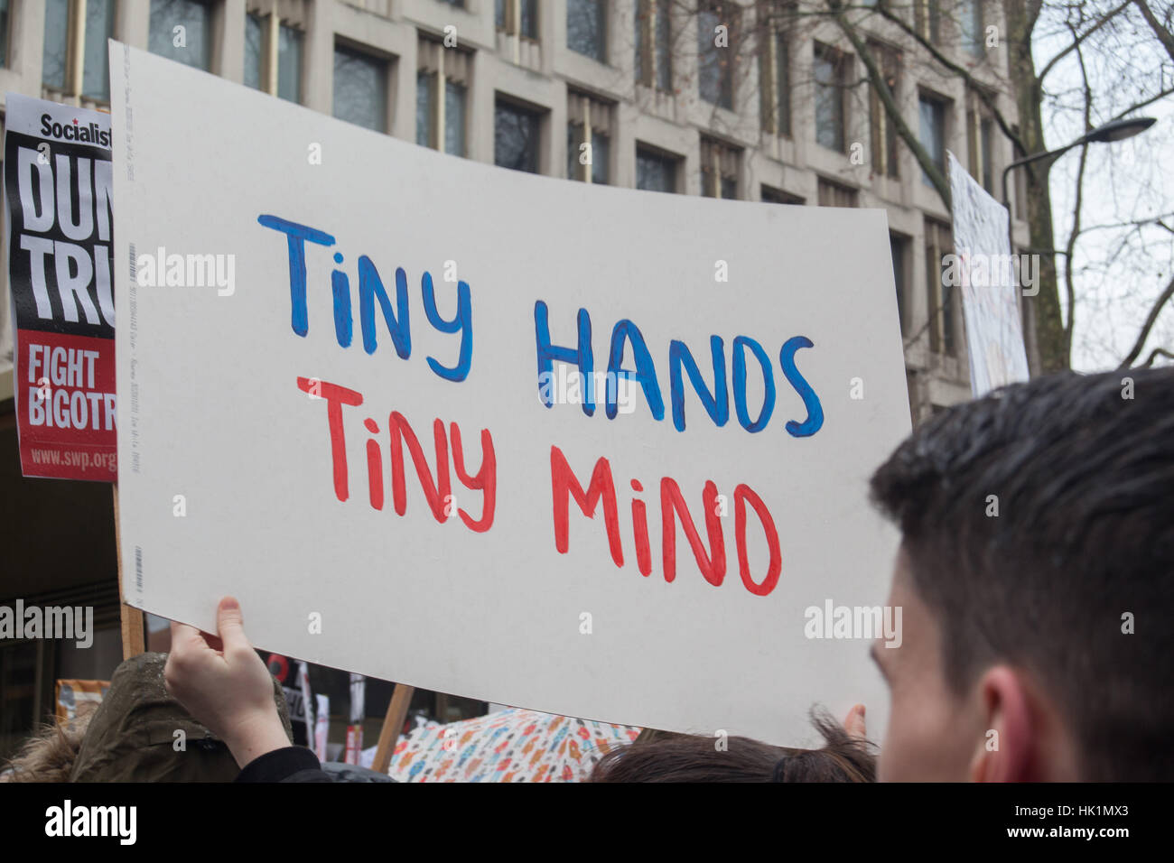 London, UK. 4th February, 2017. Tiny Hands Tiny Mind placard at 4th Feb 2017 London March against Donald Trump Credit: Pauline A Yates/Alamy Live News Stock Photo