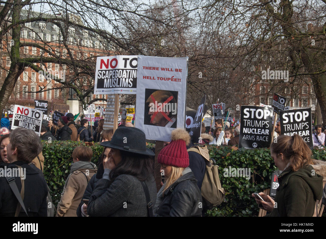 London, UK. 4th February, 2017. Hell Toupee placard at US Embassy, 4th Feb 2017 London March against Donald Trump Credit: Pauline A Yates/Alamy Live News Stock Photo