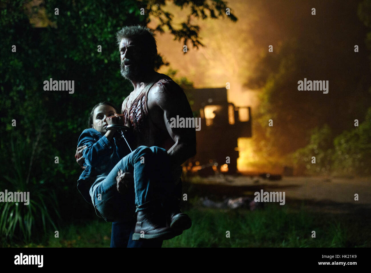LOGAN, l-r: Dafne Keen, Hugh Jackman, 2017. ph: Ben Rothstein/TM ...