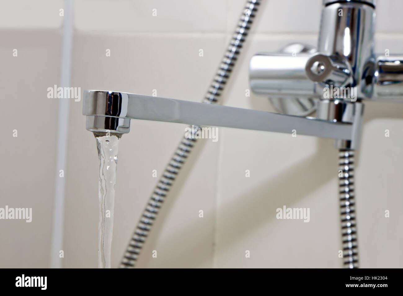 the metal sanitary water tap in bathroom Stock Photo