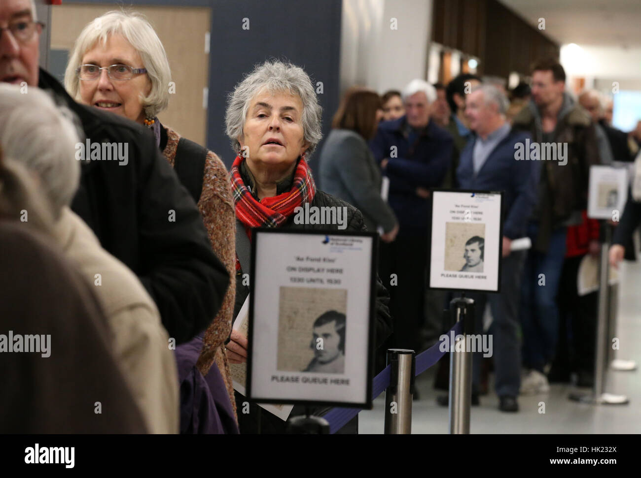 Robert Burns fans wait in a queue to view a manuscript of Ae Fond Kiss written by the bard for his departed love Agnes McLehose which went on public display for a couple of hours at Kelvin Hall in the National Library of Scotland, Glasgow. Stock Photo