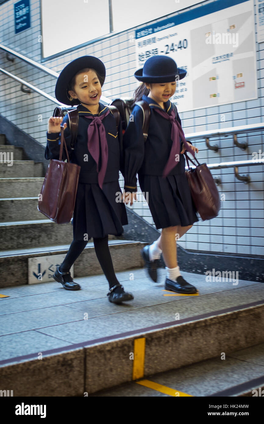 schoolgirls, girls, students, Subway, entrance to Toei Oedo Line, in Roppongi station, Tokyo, Japan. Stock Photo