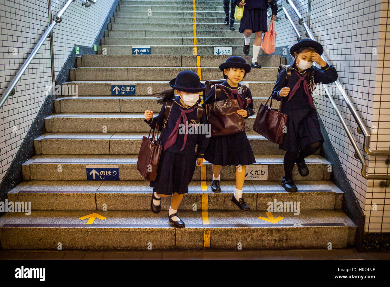 schoolgirls, girls, students, Subway, entrance to Toei Oedo Line, in Roppongi station, Tokyo, Japan. Stock Photo