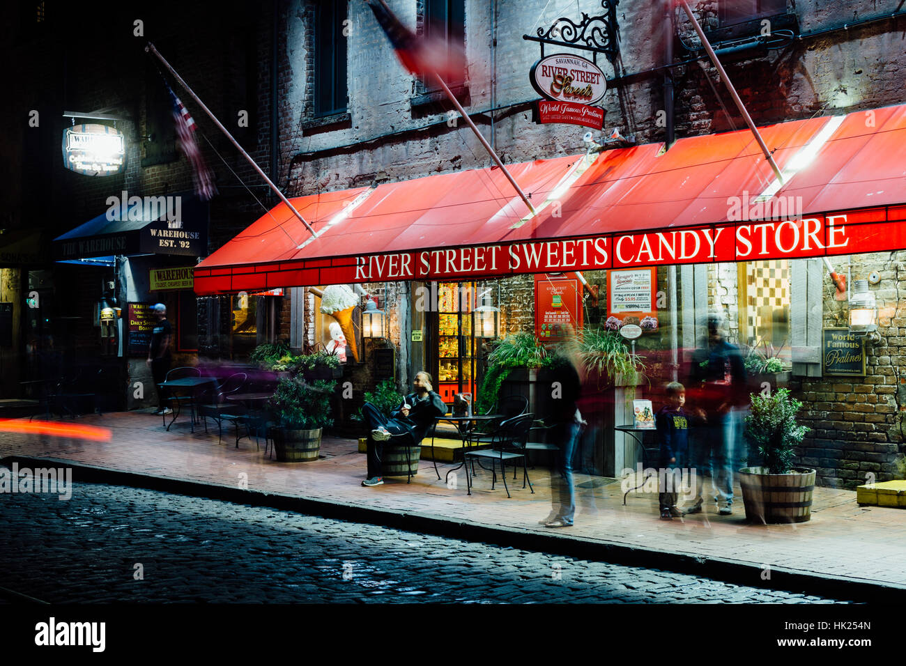 Candy store on River Street at night, in Savannah, Georgia Stock Photo ...