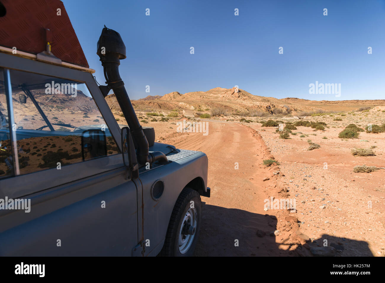 Four by 4 oldtimer driving off road in Morocco Stock Photo