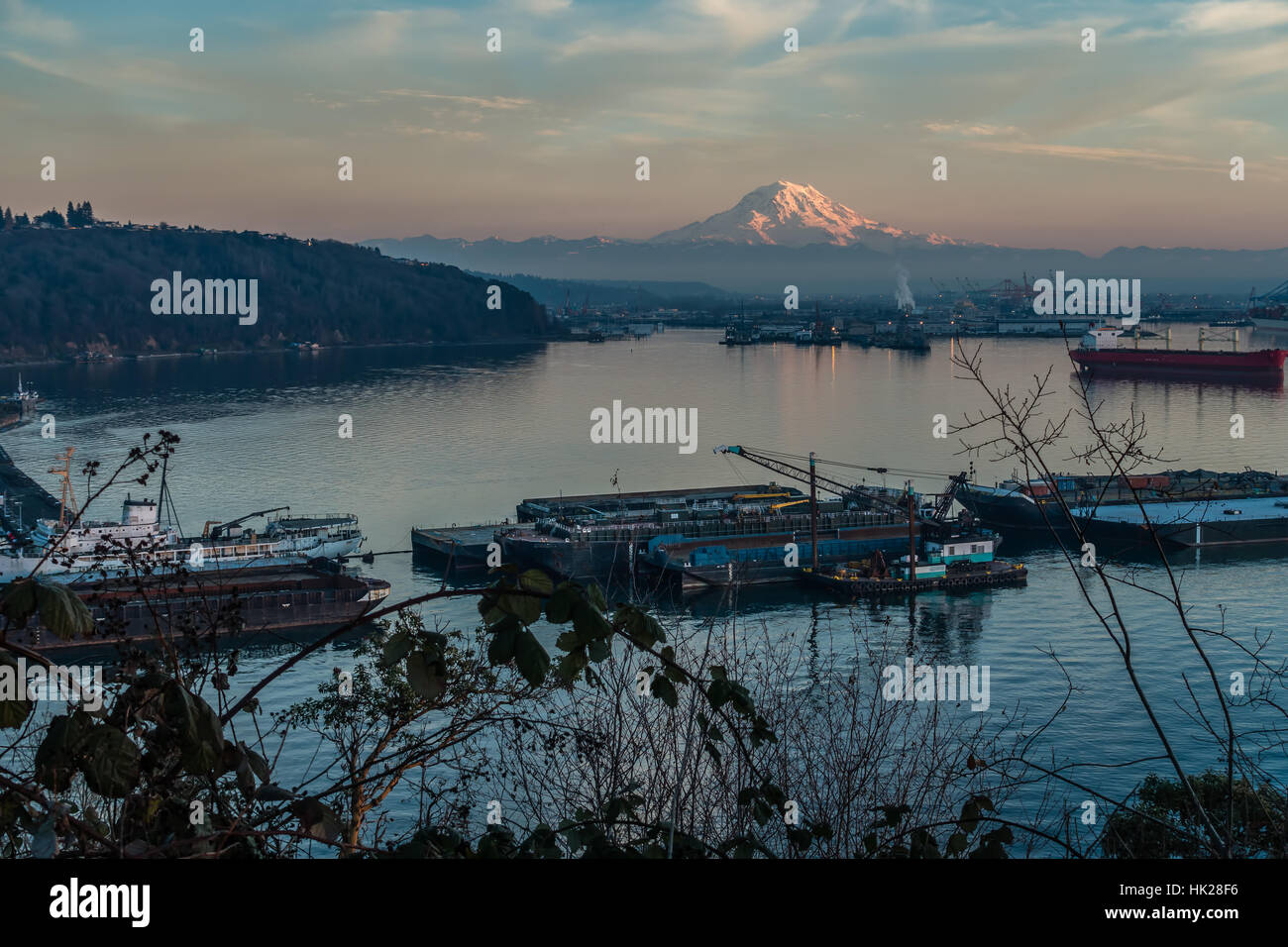 A view of the Port of Tacoma and Mount Rainier at sunset Stock Photo ...