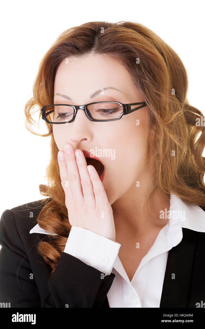 Tired business woman in a suit ,isolated over white background Stock ...