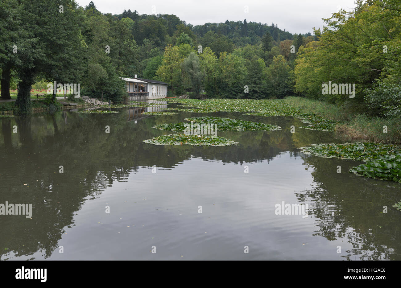 LJUBLJANA, SLOVENIA - SEPTEMBER 04, 2015: Tivoli Pond and restaurant with unrecognizable people in early autumn. View towards the north, with Roznik H Stock Photo