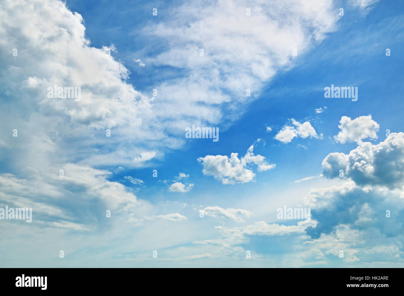 fluffy clouds in the blue sky Stock Photo - Alamy