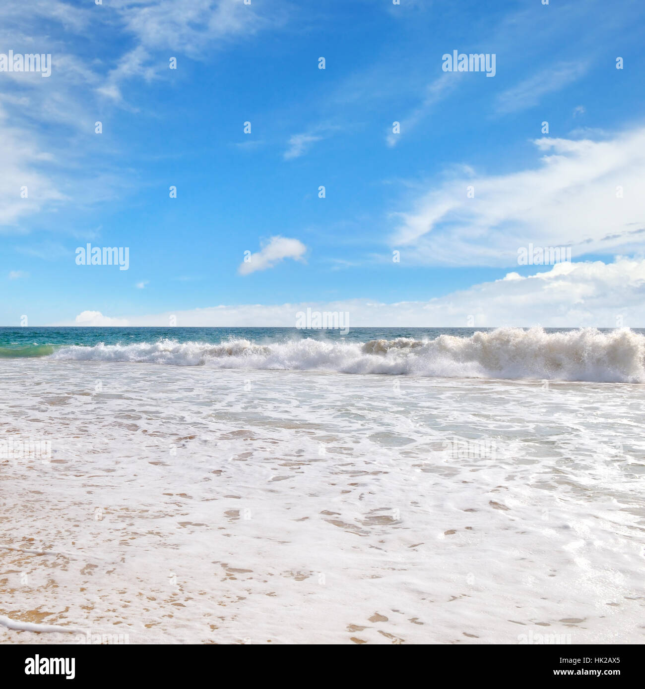 ocean, sandy beach and blue sky Stock Photo - Alamy