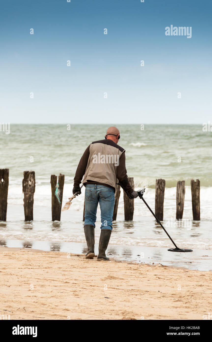 man searching for a precious metal using a metal detector Stock Photo ...