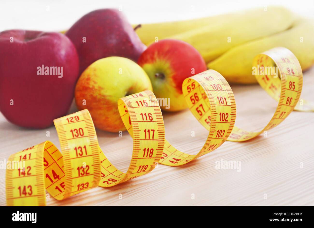 apples and bananas with tape measure diet concept Stock Photo Alamy