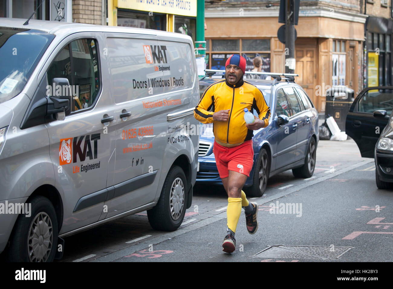 LONDON, ENGLAND JULY 12, 2016 man in the yellow sportswear running on