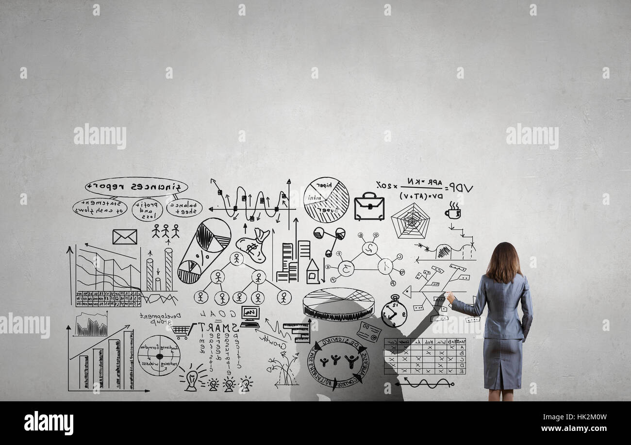 Rear view of young businesswoman drawing strategy plan on screen Stock ...