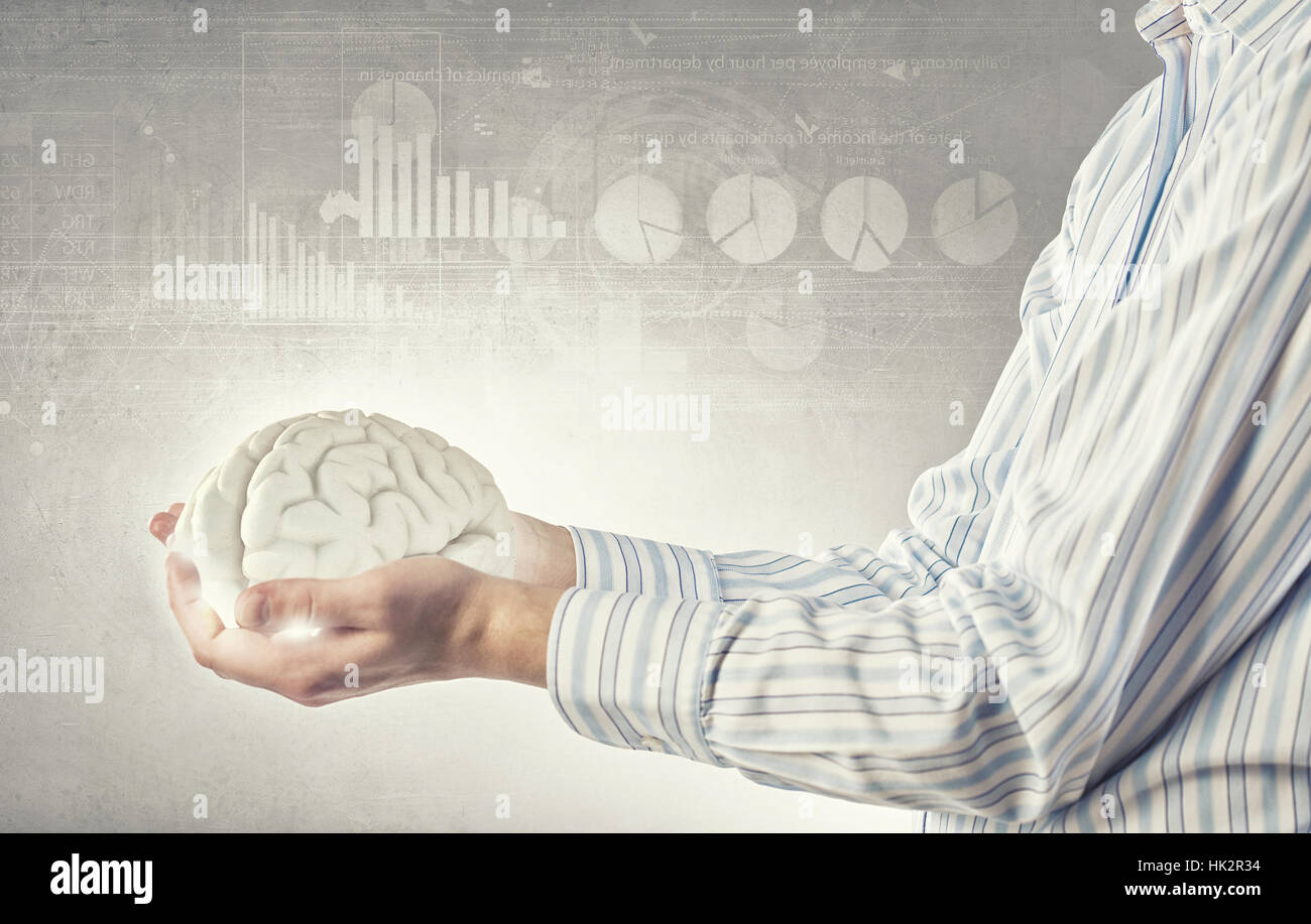 Close up of human hand holding brain Stock Photo - Alamy