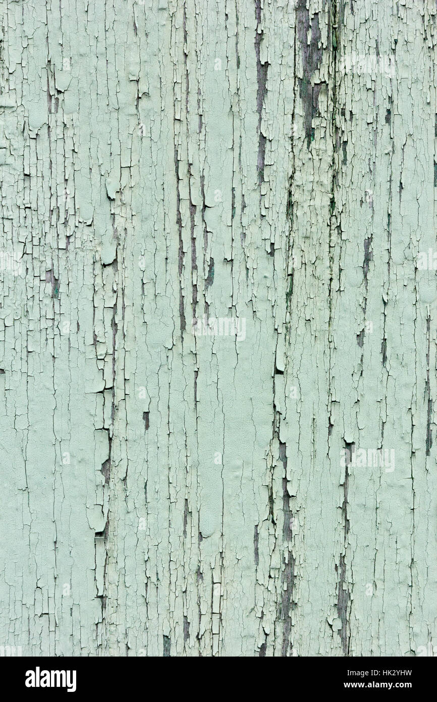 Green paint peeling off a wood Stock Photo