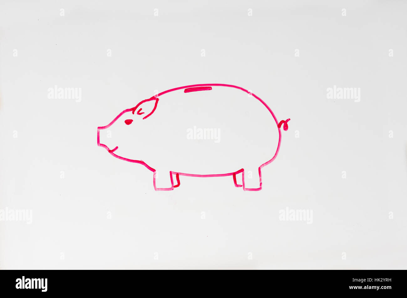 drawing of a piggy bank in pink on a whiteboard Stock Photo