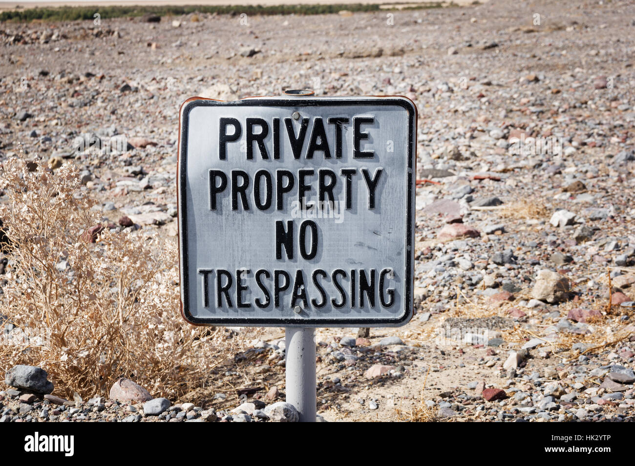 old private property no trespassing sign in the desert Stock Photo