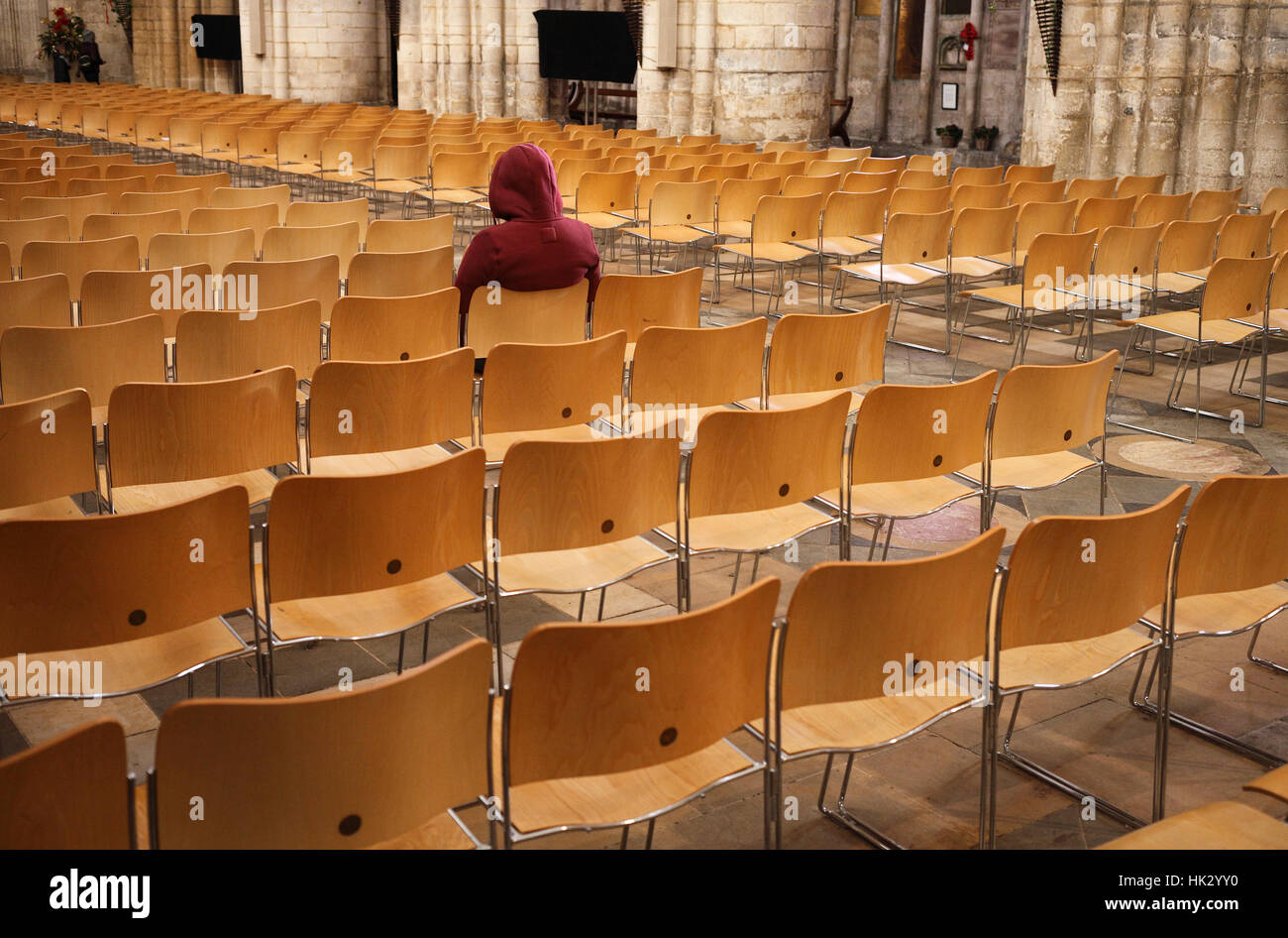A man in deep contemplation or prayer in Ely Cathedral. Stock Photo