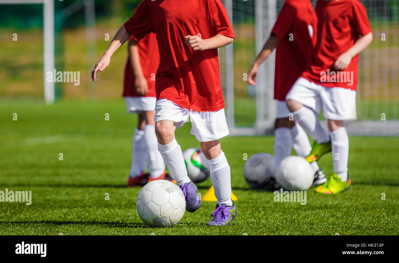 Boys Training Soccer on the Soccer Field. Children Football Training