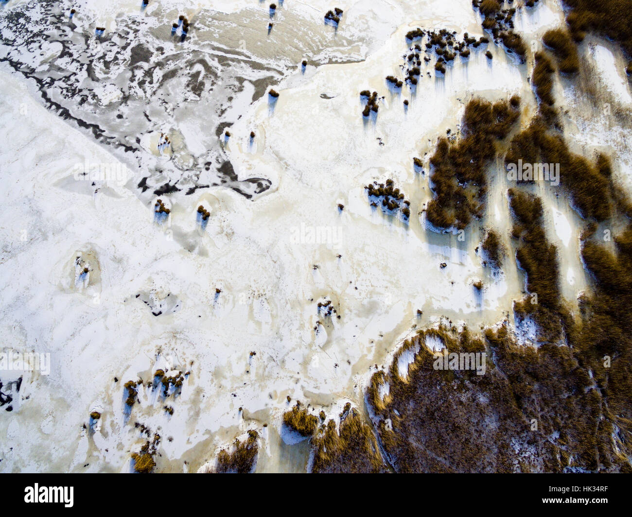 aerial view of frozen forest lake in winter. drone photography ...