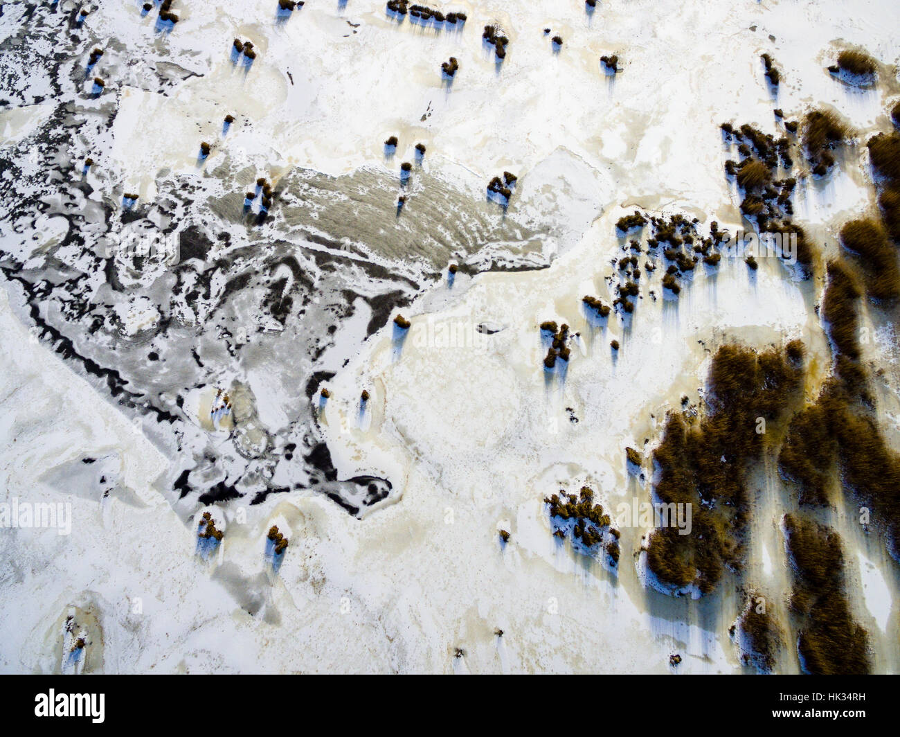 aerial view of frozen forest lake in winter. drone photography ...