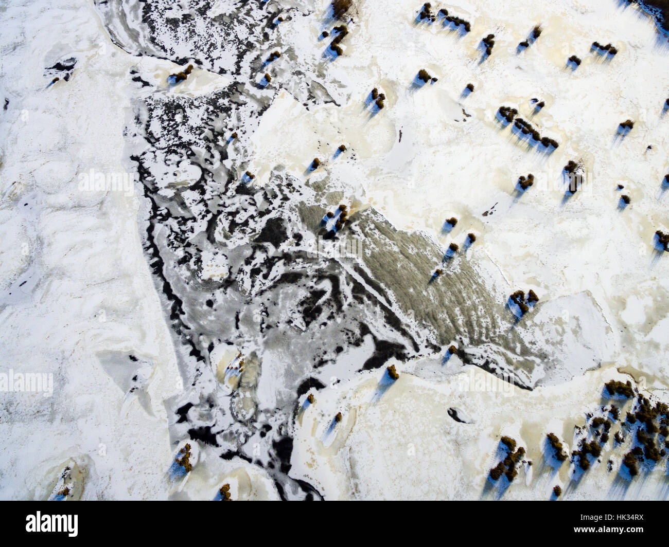 aerial view of frozen forest lake in winter. drone photography ...