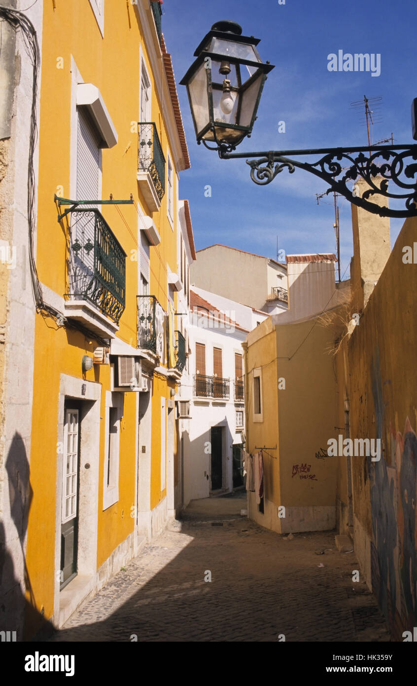 Scenic and colorful narrow street in Alfama, Lisbon, Portugal Stock ...