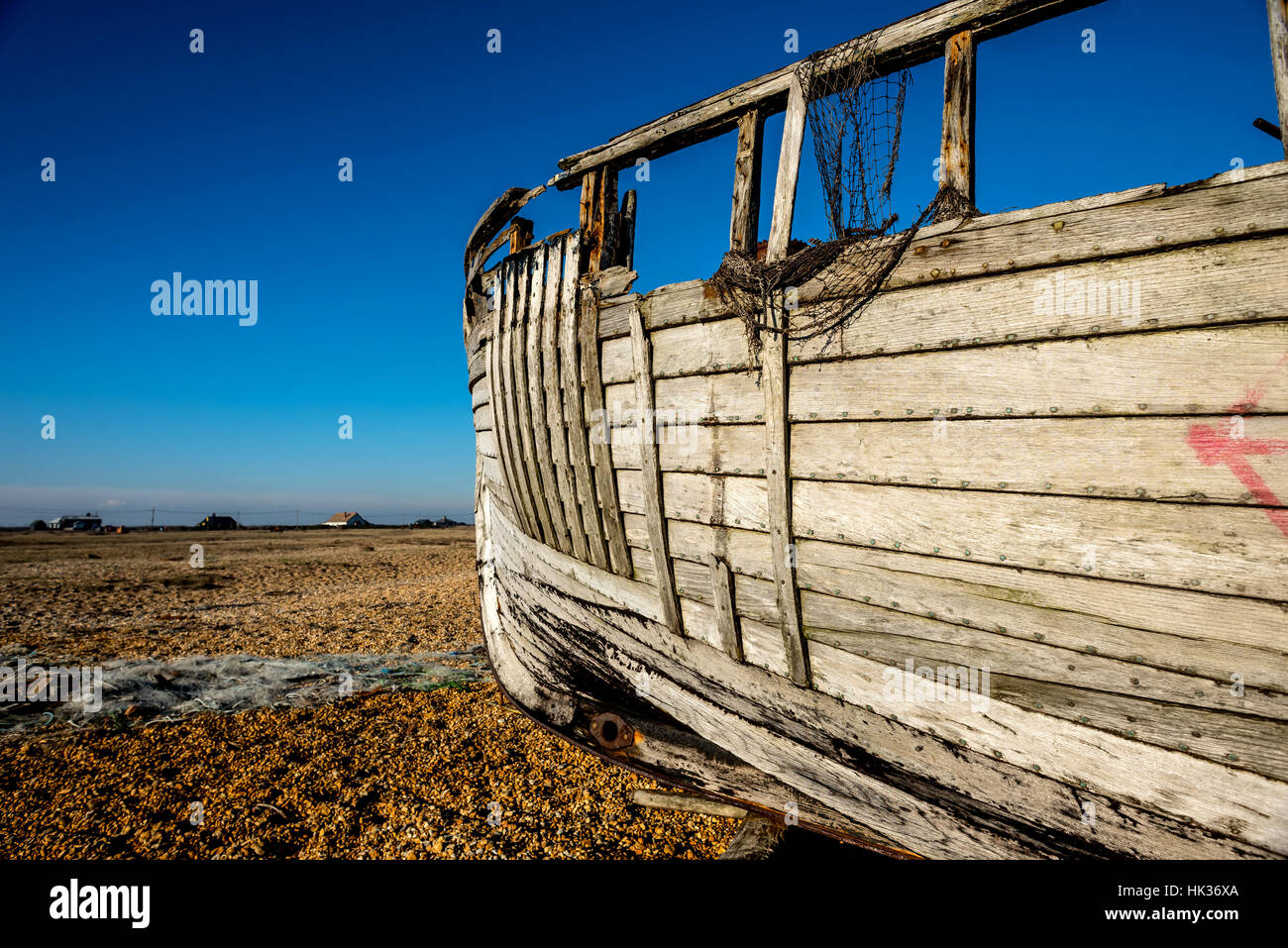 A derelict fishing boat on the beach at Dungeness Stock Photo - Alamy