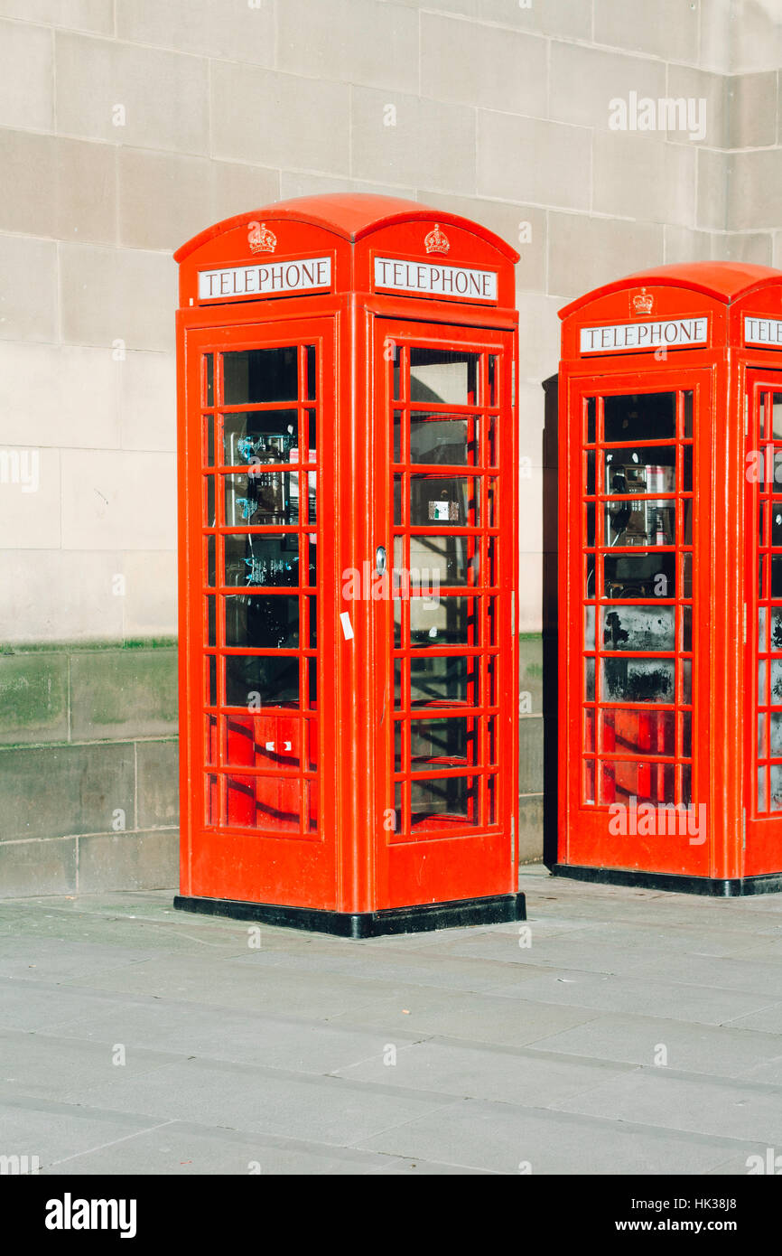 Red British telephone booths in the sun Stock Photo