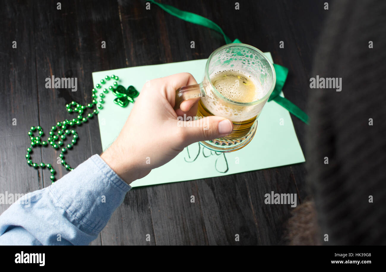 Man drinking beer and celebrating St Patrick day  close up Stock Photo