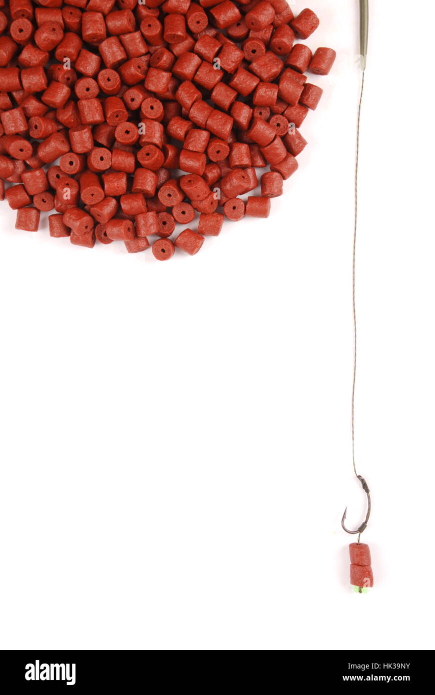 Fishing bait with hook and red pre-drilled halibut pellets for carp fishing  isolated on white background with soft shadow Stock Photo - Alamy