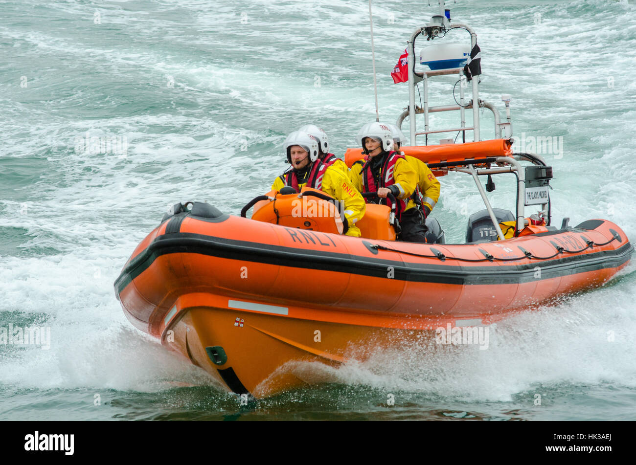 An RNLI inshore lifeboat puts on a display at Newquay lifeboat day Stock Photo