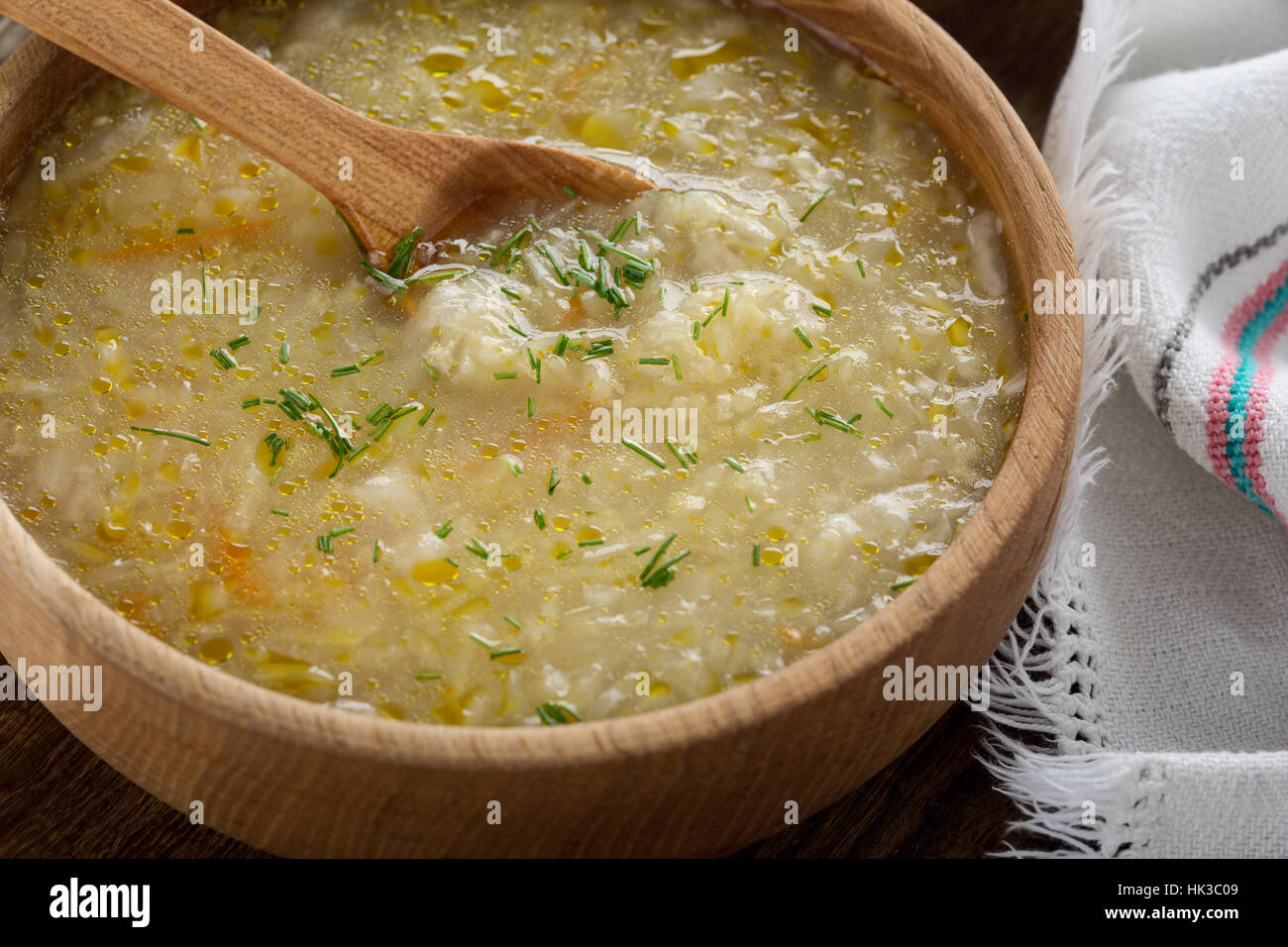 Ukrainian sauerkraut soup kapusniak with millet on rustic table in