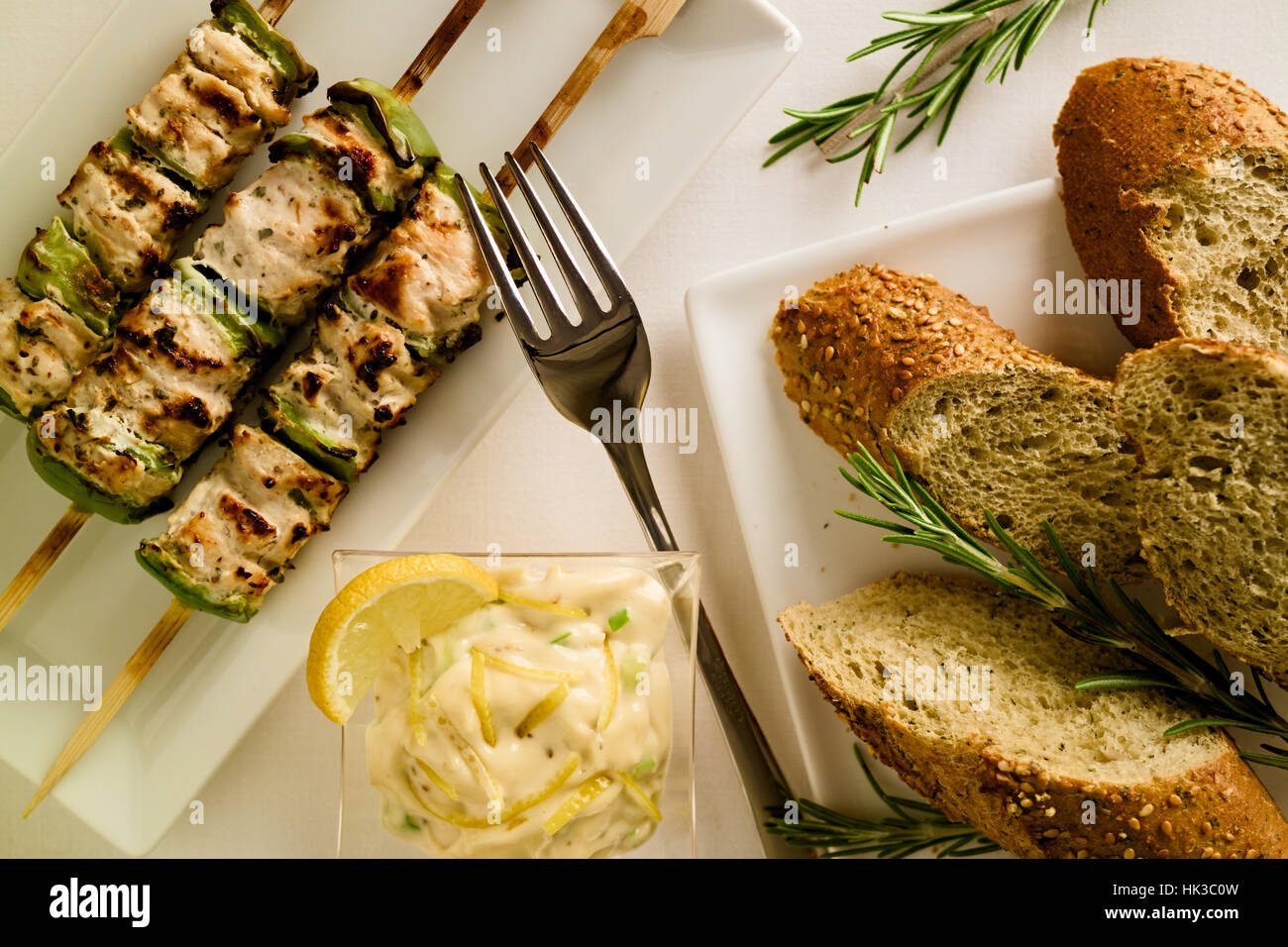 Barbeque Grilled chicken and peppers on skewer served on rectangular plate  in restaurant setting with Macedoine dipping sauce and bread Stock Photo -  Alamy