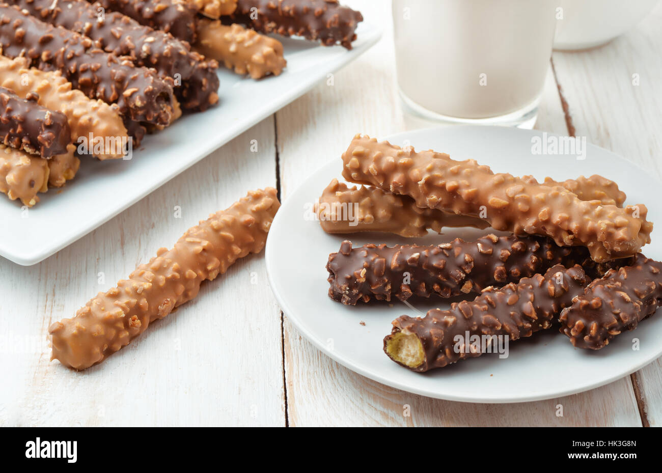 Still life with chocolate covered cookie sticks Stock Photo