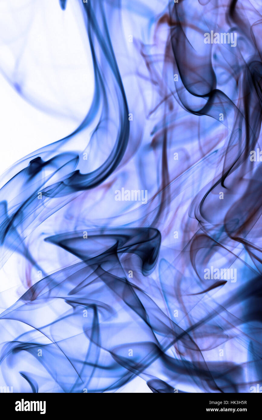 Blue smoke in white background Stock Photo - Alamy