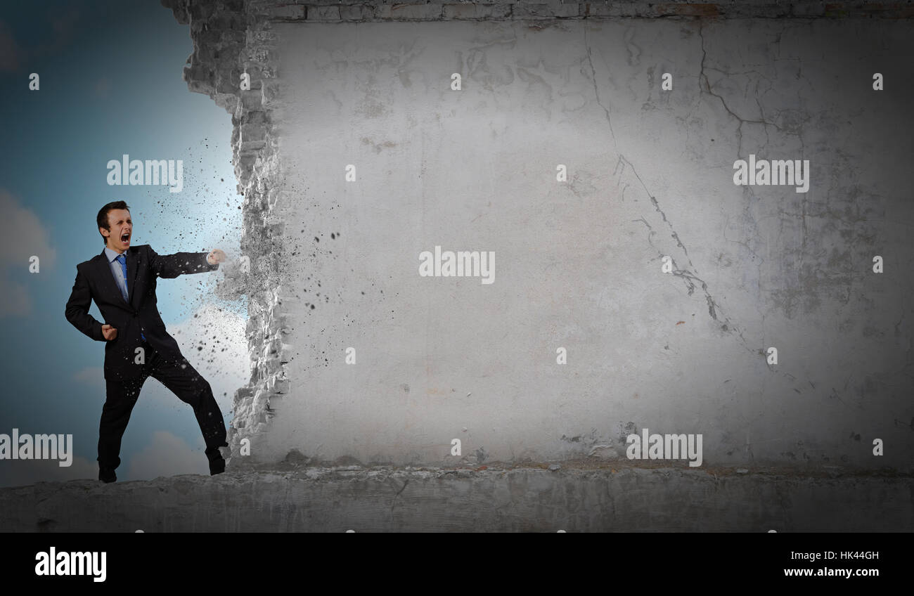 Businessman breaking stone wall karate hi-res stock photography and ...