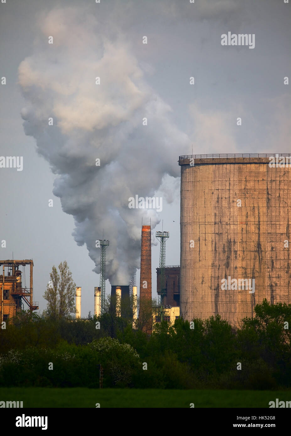 Industrial plant emitting smoke Stock Photo