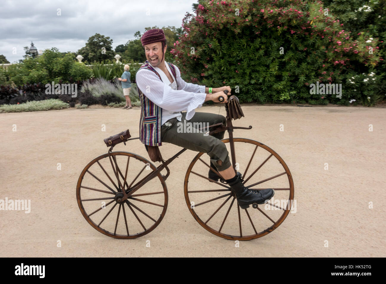 A man rides a Velocvelocipede (fast foot), bicycle commonly known as a boneshaker popular in the mid to late 1800s. Stock Photo