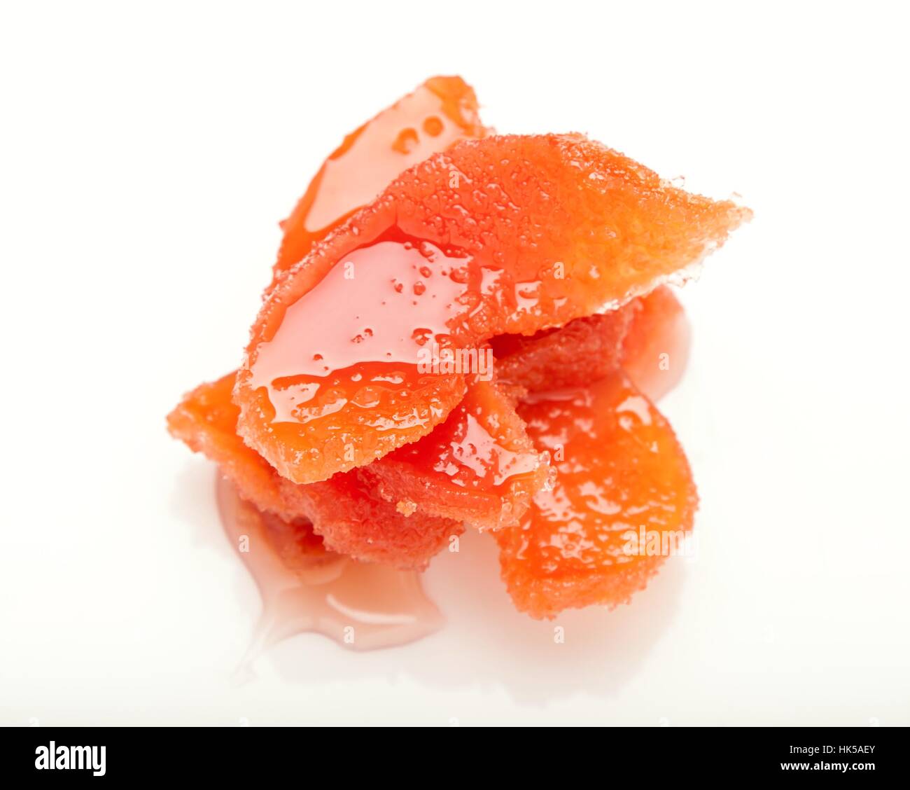 candied segment of quince in sweet jam Stock Photo