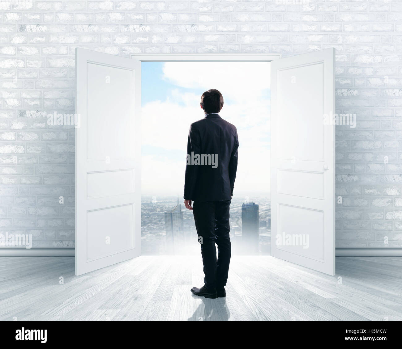 Image of businessman standing in front of opened door hi-res stock ...