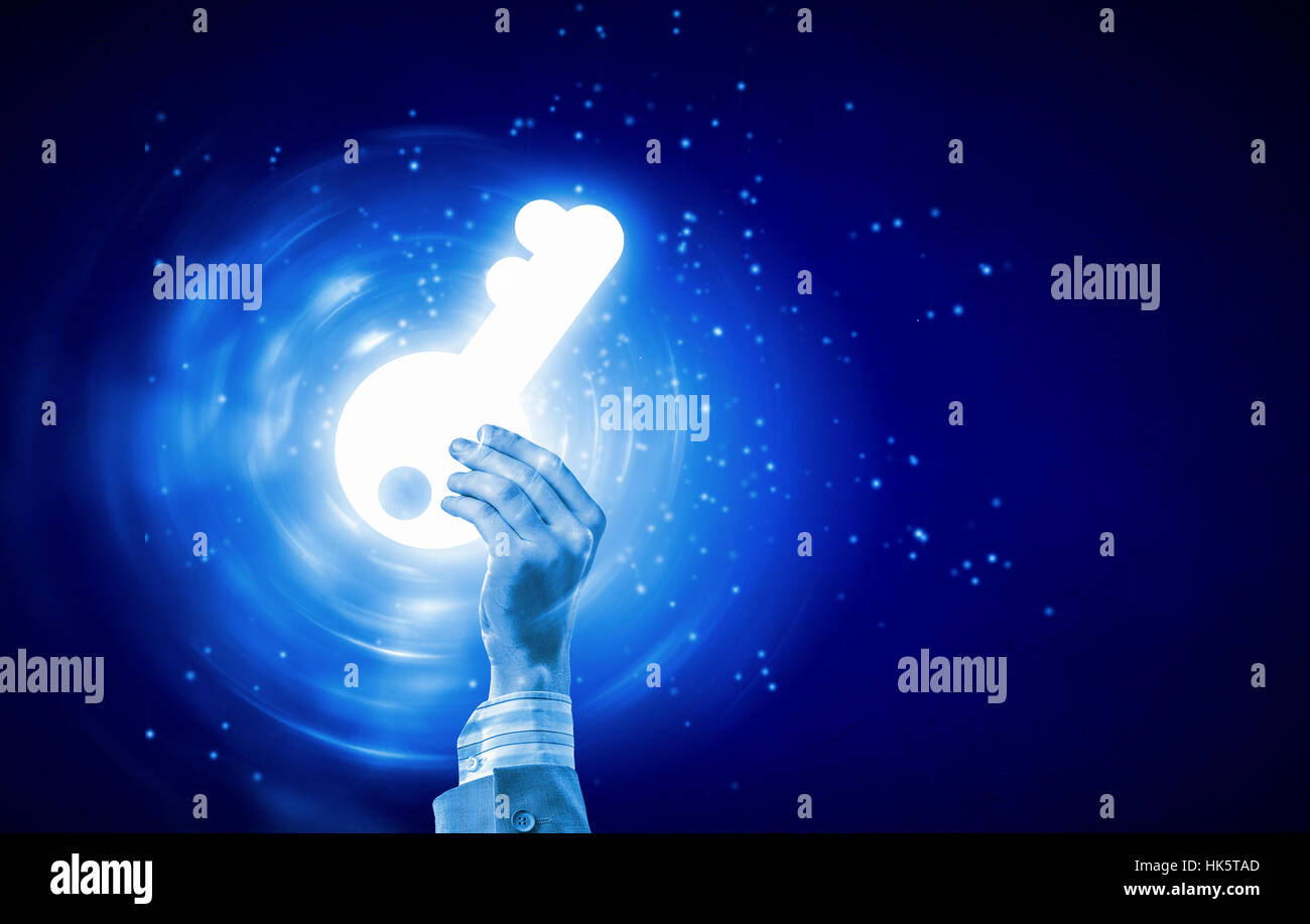 Close up of human hand with digital key icon Stock Photo - Alamy