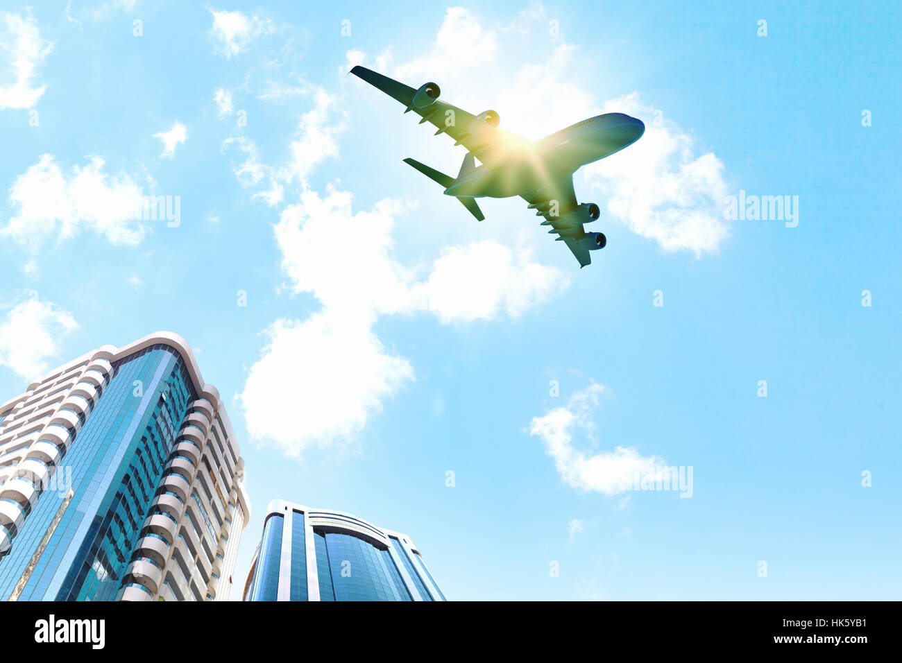 Image of airplane flying above skyscrapers. Bottom view Stock Photo - Alamy