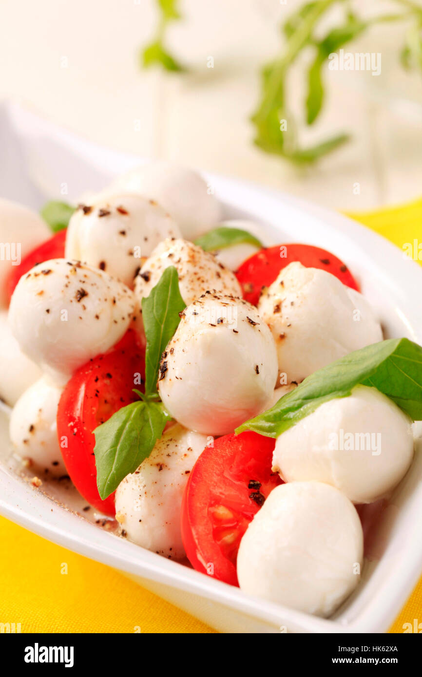 Bowl of mozzarella cheese, tomato and basil Stock Photo - Alamy