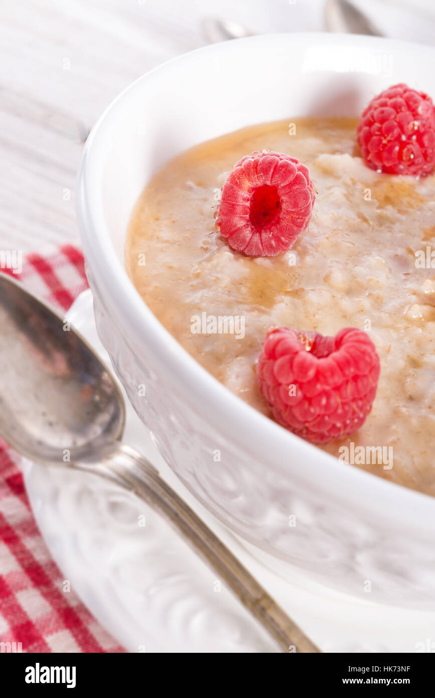 Oatmeal With Raspberry oatmeal with fresh raspberry Stock Photo - Alamy