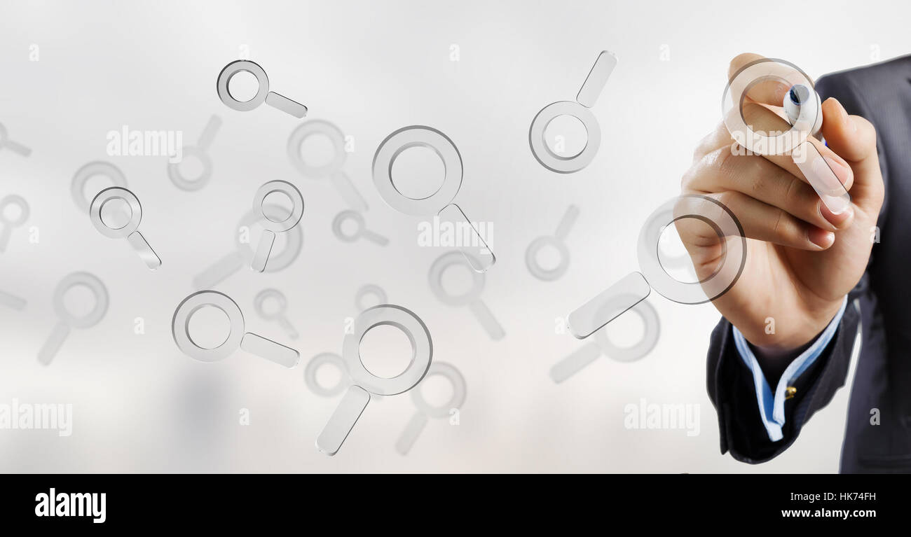 Businessman selecting with marker search glass icon on screen Stock ...