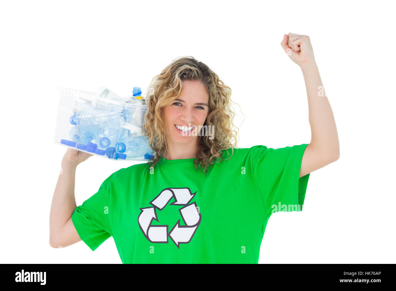 Cheerful environmental activist holding box of recyclables on white ...