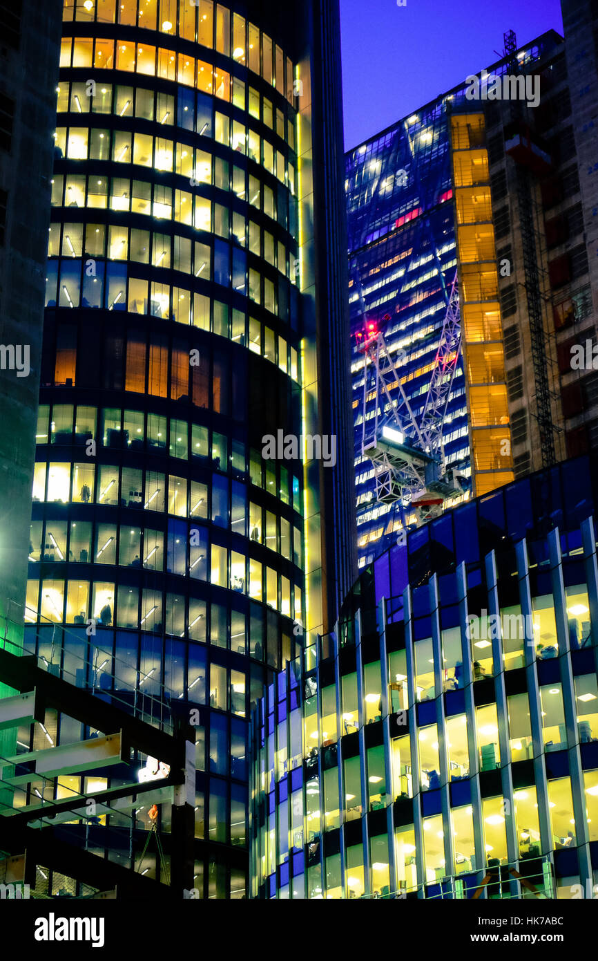 Futuristic looking office buildings rise into the night sky Stock Photo